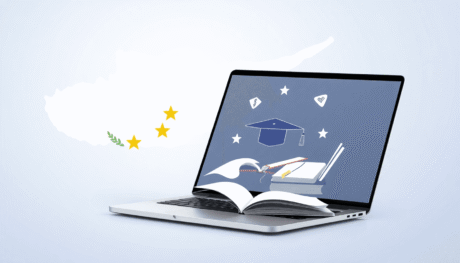 Laptop displaying educational icons over a Cyprus map with EU stars, symbolizing cross-border online learning and VAT compliance.